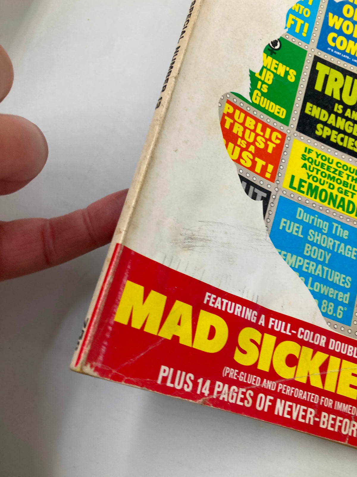 Side view of Mad Magazine No. 13 showing the cover color and the text 'MAD SICKIE-STICKIES' emphasizing its collectible feature from 1974.