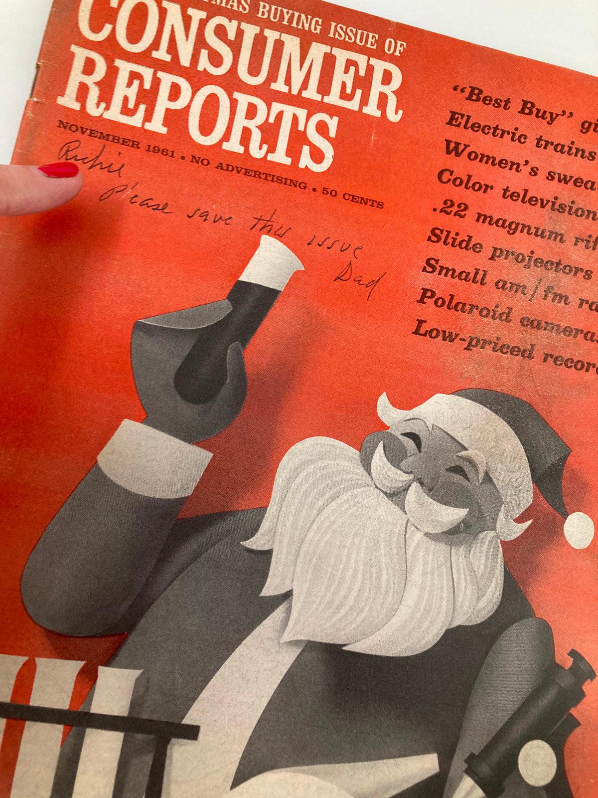 Detailed view of the VTG Consumer Reports Magazine November 1961 cover showing Santa Claus and handwritten note, labeled 'The Christmas Buying Issue'.
