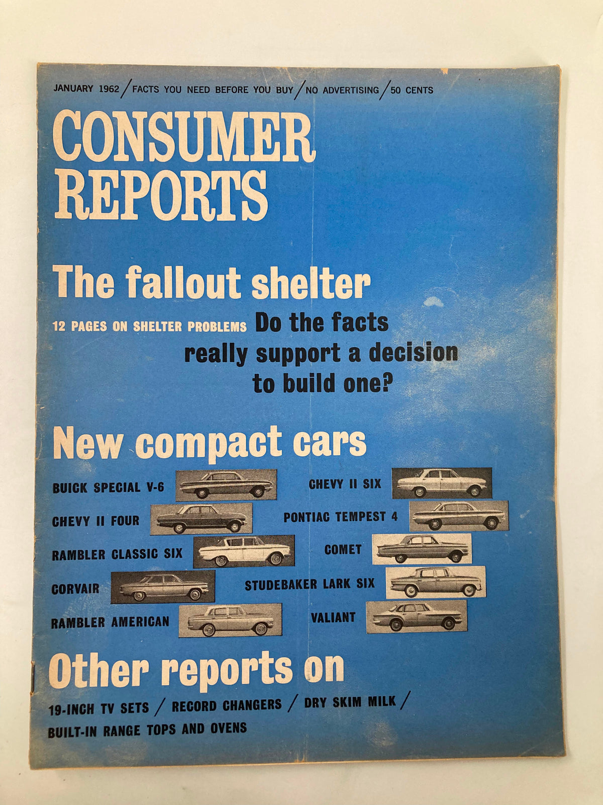 Cover of the VTG Consumer Reports Magazine January 1962 featuring the headline 'The Fallout Shelter' discussing civil defense concerns during the Cold War. Includes images of various new compact cars.
