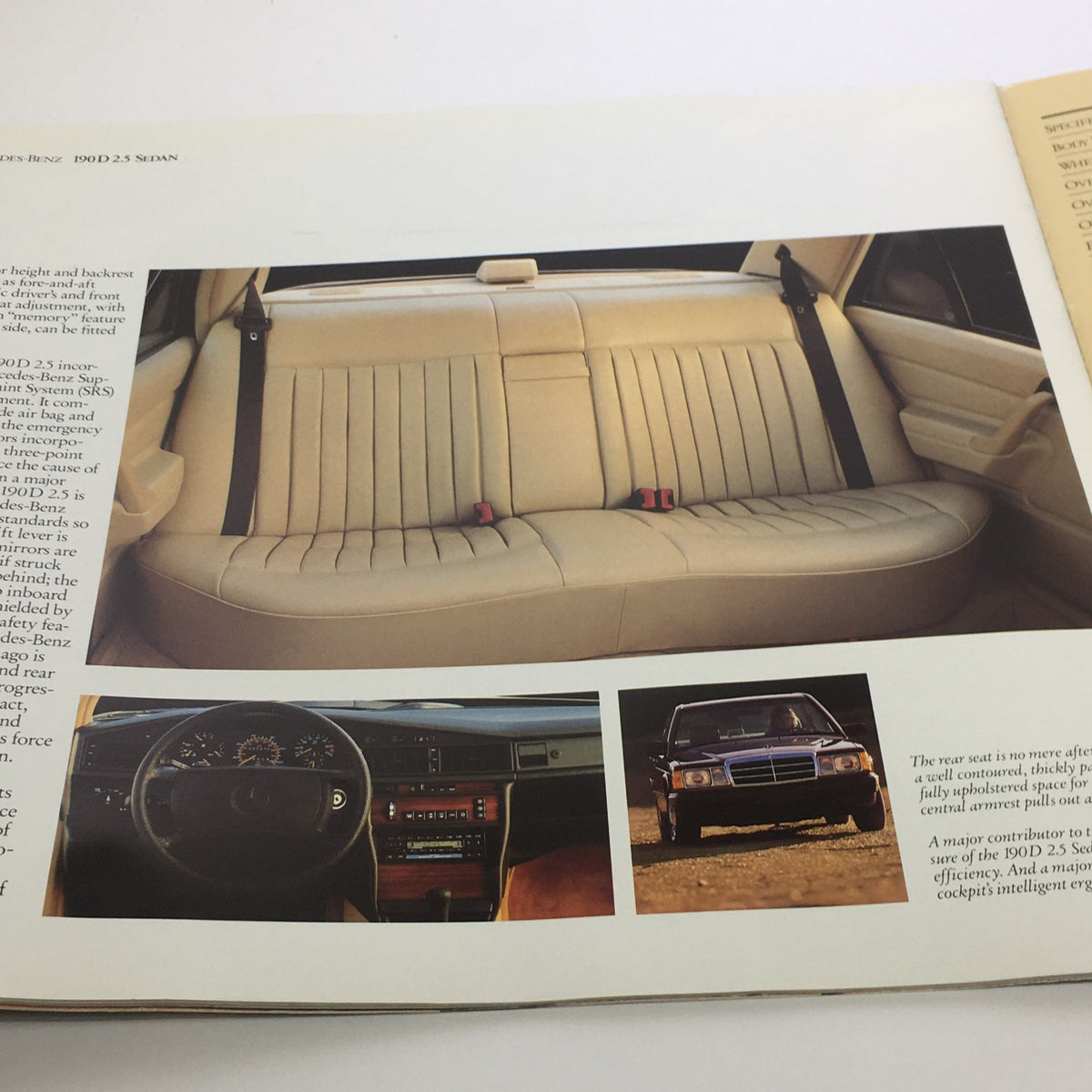 Photos from the 1986 Mercedes-Benz 190 Class Dealership Car Auto Brochure Catalog displaying the plush interior, including seating and dashboard of the vehicle.