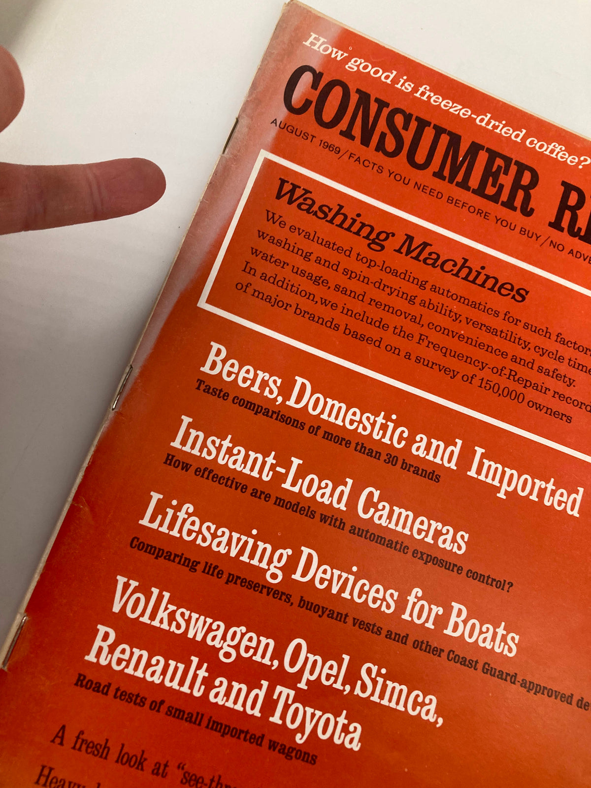 Close-up of the Consumer Reports Magazine cover from August 1969, highlighting the beer comparison feature and washing machine evaluations, emphasizing its informative nature.