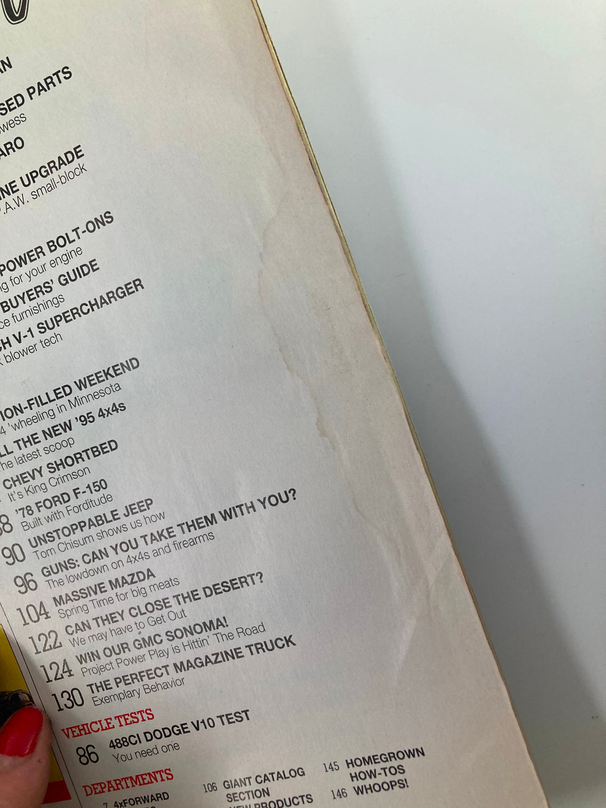 Close-up of the spine of Petersen's 4 Wheel & Off-Road Magazine October 1994 showing minor wear and water damage, emphasizing its collectible condition.