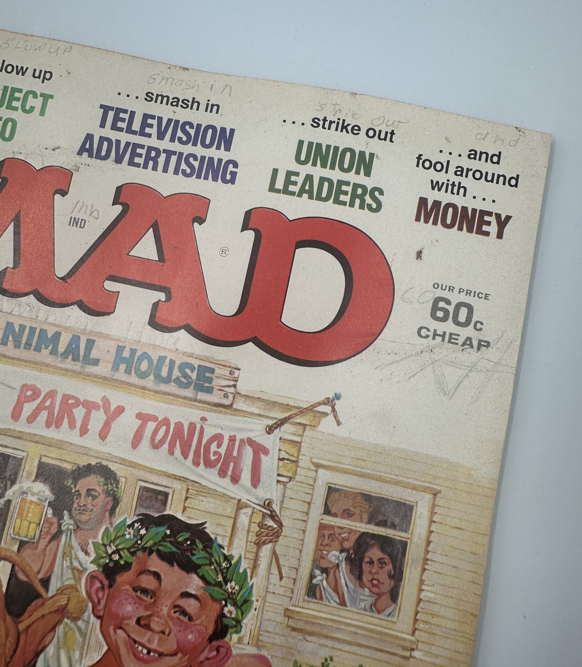 Cover of MAD Magazine No. 207, June 1979 featuring Animal House TV advertising satire, highlighting humorous elements and content focus. Graded Very Good (VG 4.0), displaying signs of age and handling.