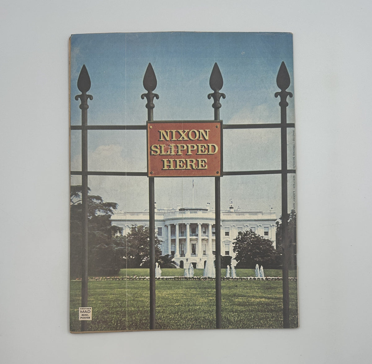 Back cover of MAD Magazine No. 167 June 1974 featuring a photo of the White House with a sign that reads 'NIXON SLIPPED HERE'.