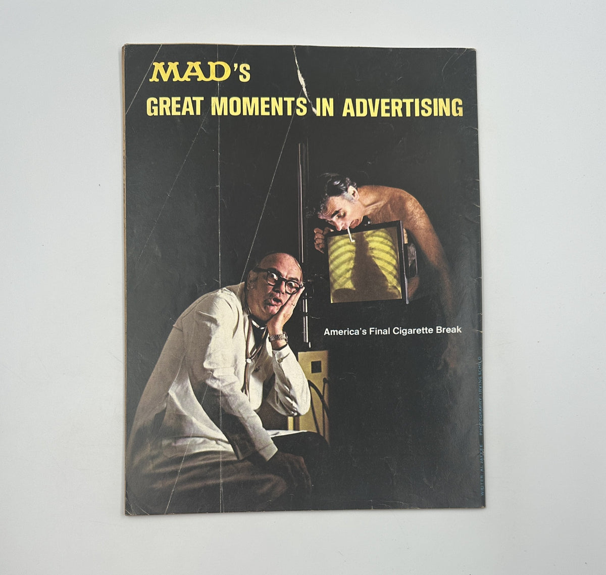 Cover of MAD's Great Moments in Advertising, showcasing a provocative image in relation to advertising themes, a separate publication from MAD Magazine.