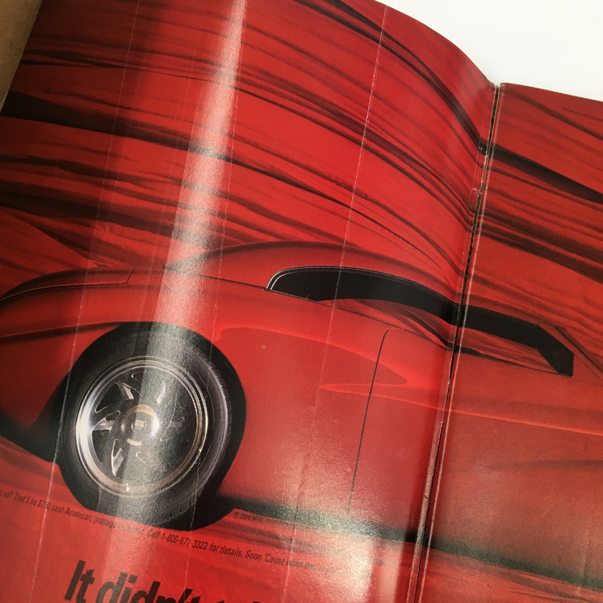 Interior page from Rod & Custom Magazine August 1994 displaying a red sports car and featuring vibrant graphics, emphasizing automotive performance.