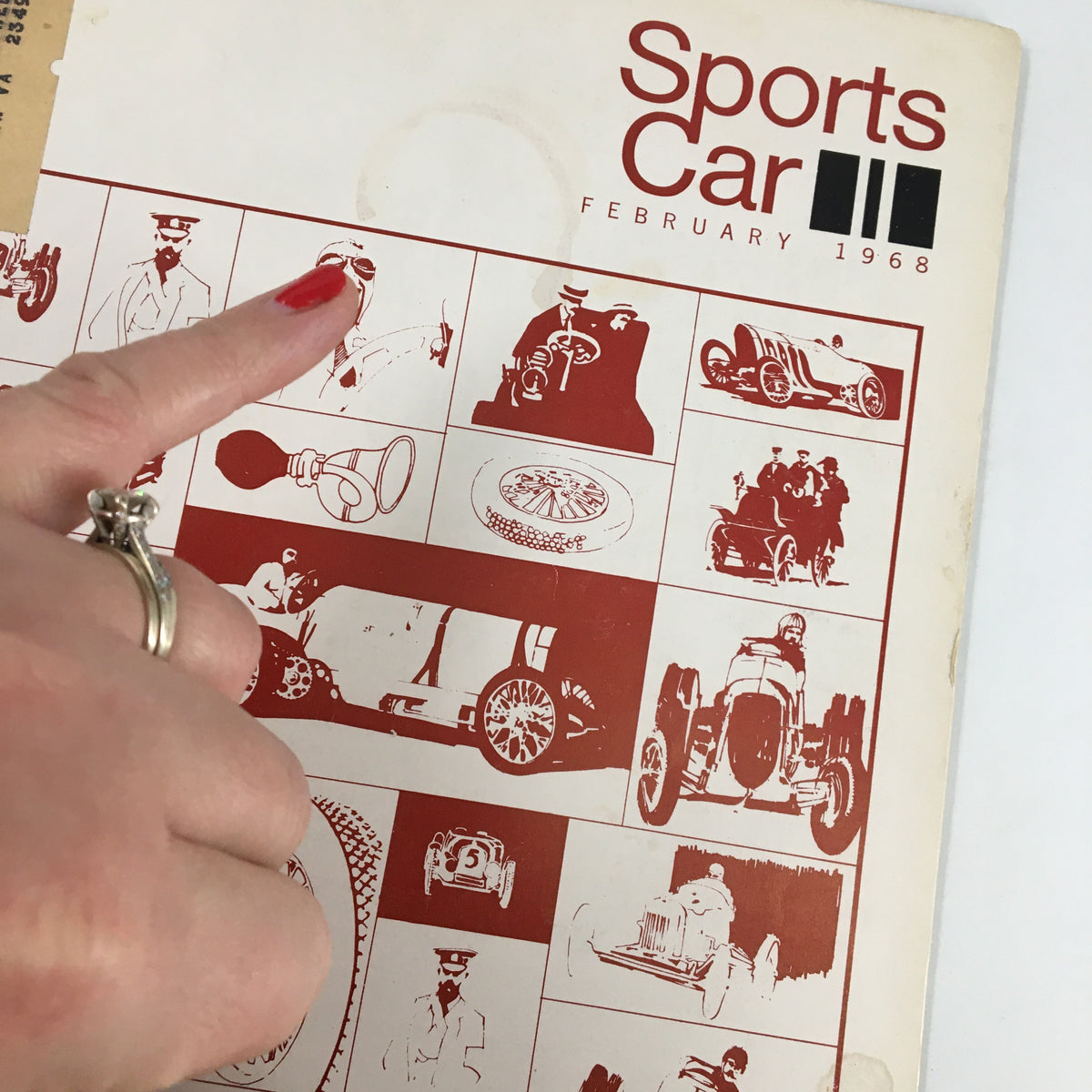 Close-up of the cover of VTG Sports Car Magazine February 1968, showing intricate automotive graphics, with the title 'The Short Happy Life of a Tire Maker'.