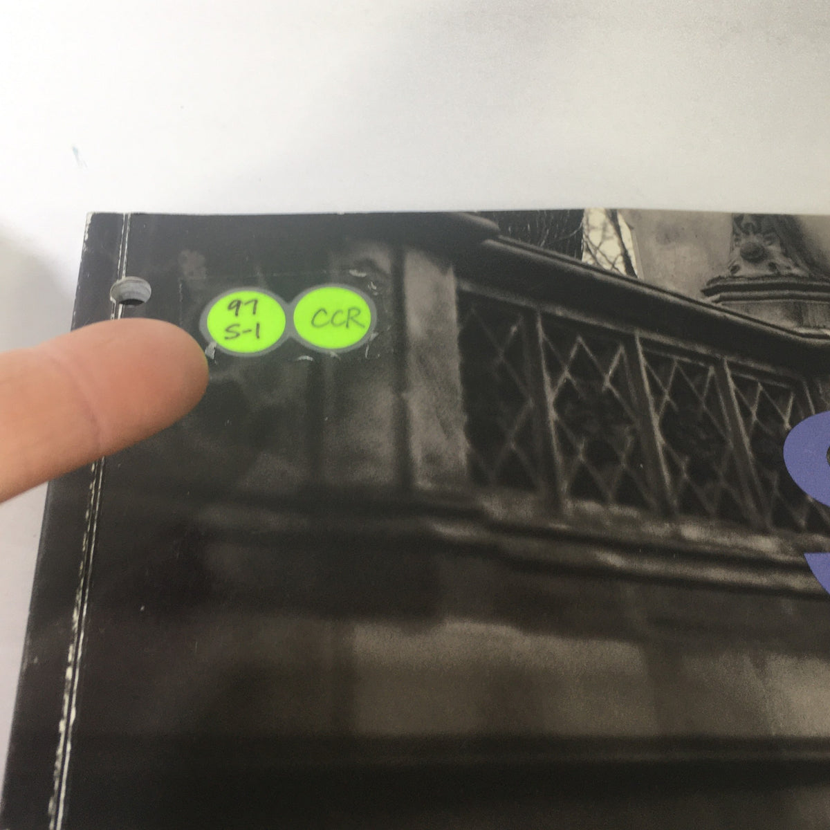 Side edge of the 1997 Mercedes-Benz S-Class Dealership Car Auto Brochure Catalog showing catalog identification stickers.