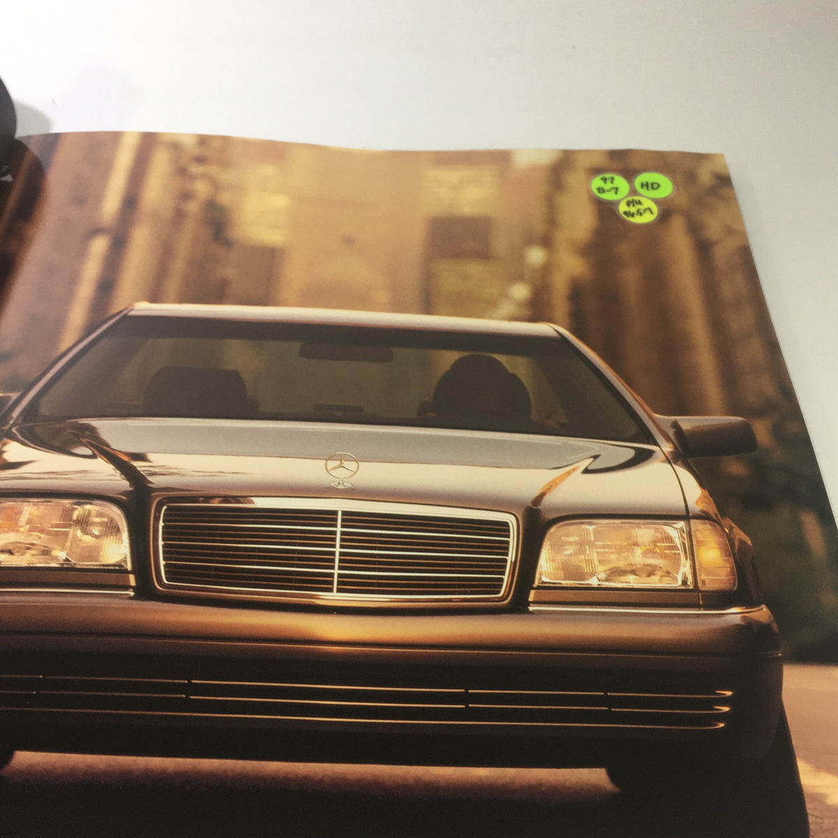 Interior page of the 1997 Mercedes-Benz S-Class Dealership Car Auto Brochure Catalog, showcasing the elegant front view of a 1997 Mercedes-Benz S-Class car.