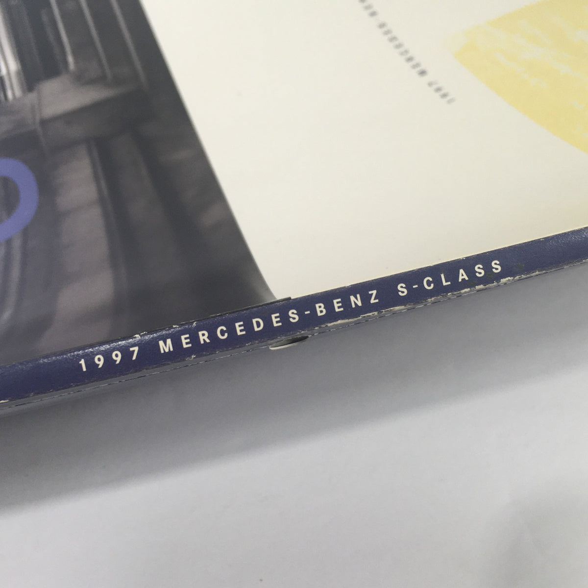 Spine view of the 1997 Mercedes-Benz S-Class Dealership Car Auto Brochure Catalog, displaying the title and year.