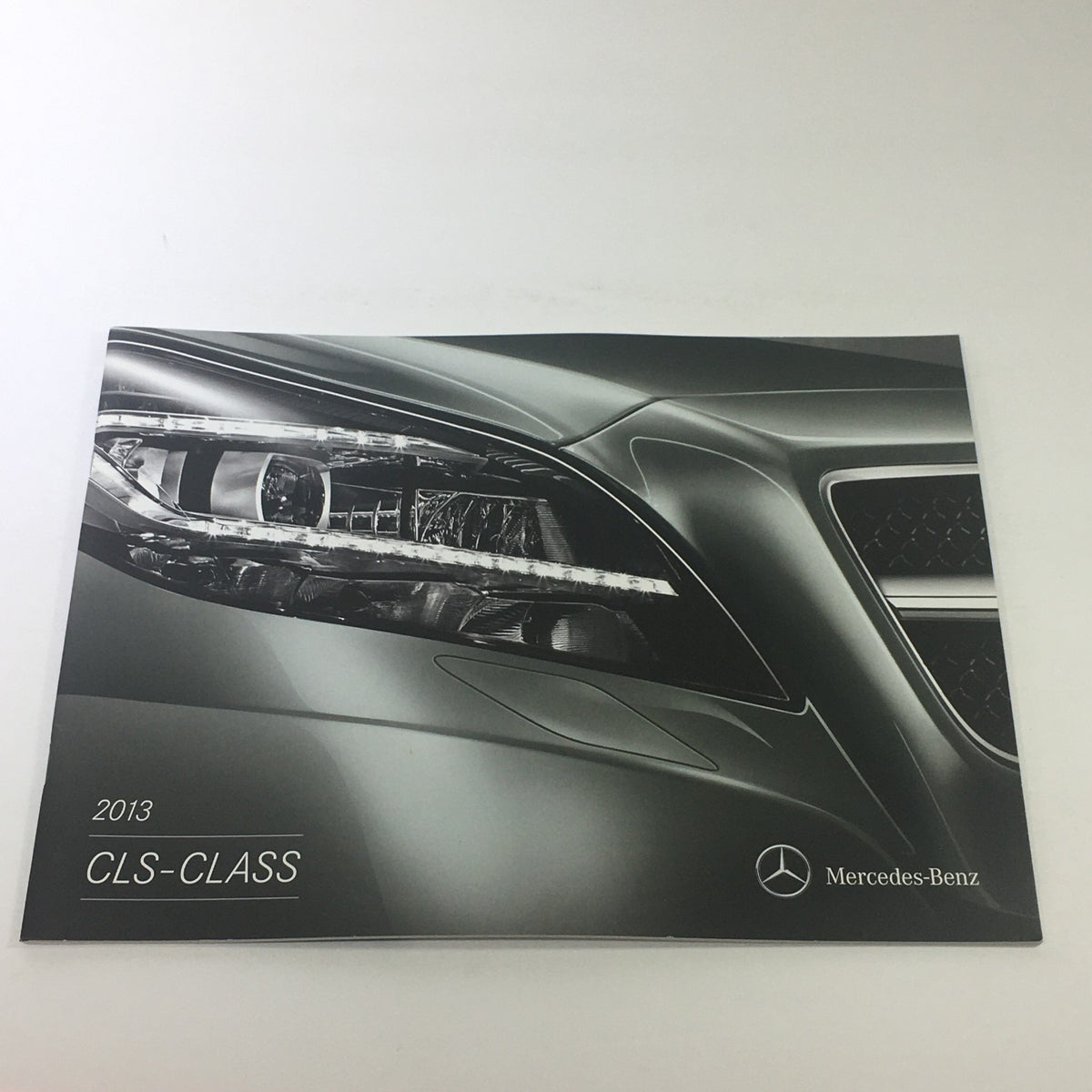 2013 Mercedes-Benz CLS-Class Dealership Car Auto Brochure Catalog featuring a close-up of the car's headlight design.