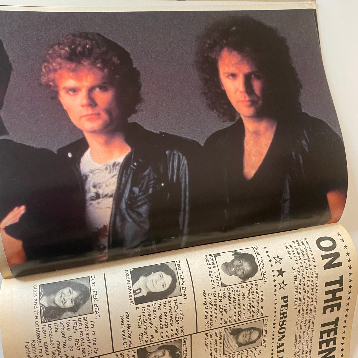Members of a rock band posing for a photo, accompanied by a page from Teen Beat Magazine October 1983.