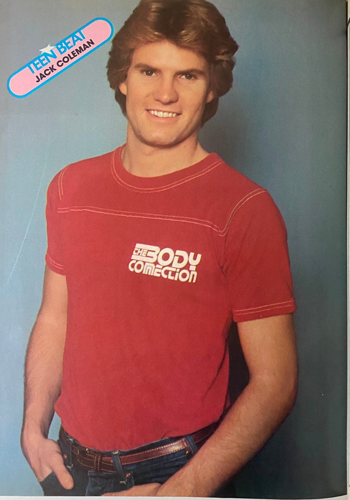 Jack Coleman smiling while wearing a red T-shirt, featured in Teen Beat Magazine October 1983.