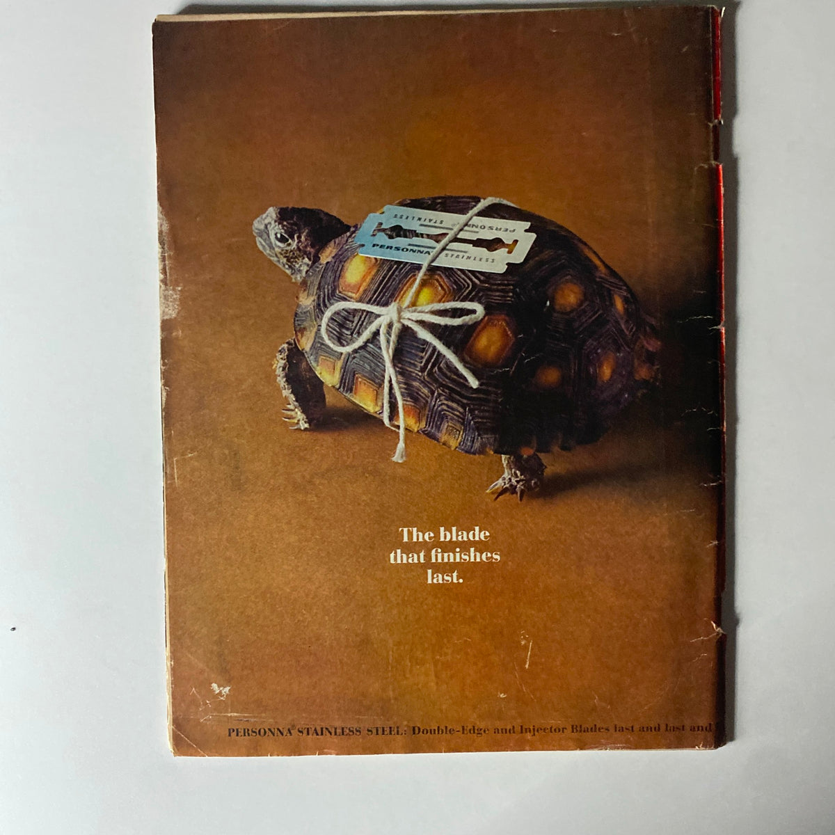 Back cover of Time Magazine August 27, 1965 Vol 86 No. 9, displaying an artistic image of a turtle with a razor blade attached, symbolizing enduring quality in a vintage advertisement.