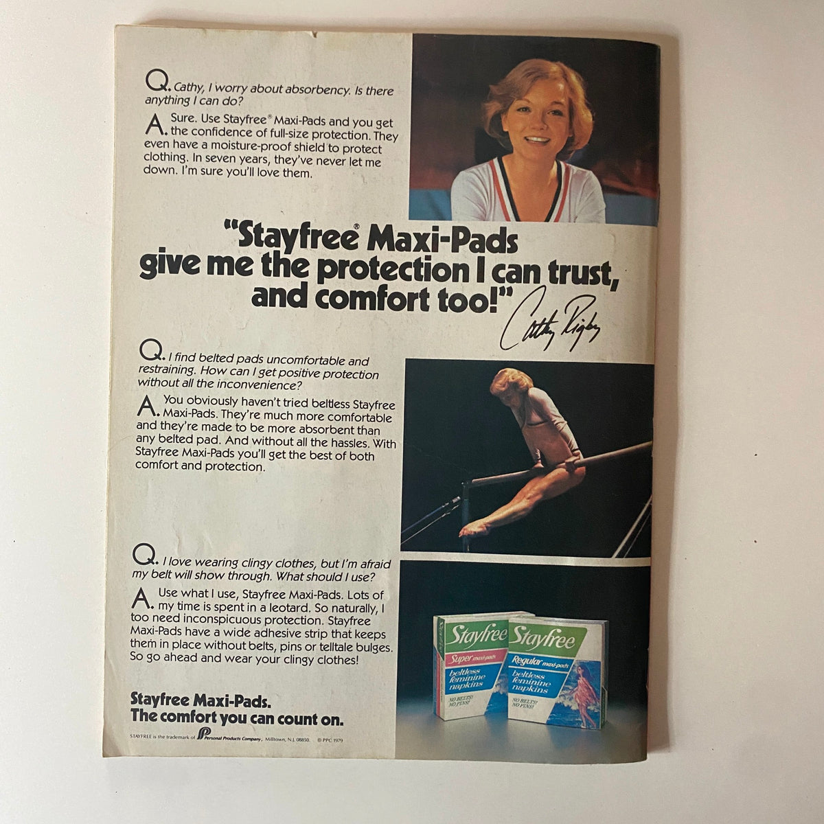 Advertisement for Stayfree Maxi-Pads, featuring a testimonial from gymnast Cathy Rigby discussing comfort and protection.