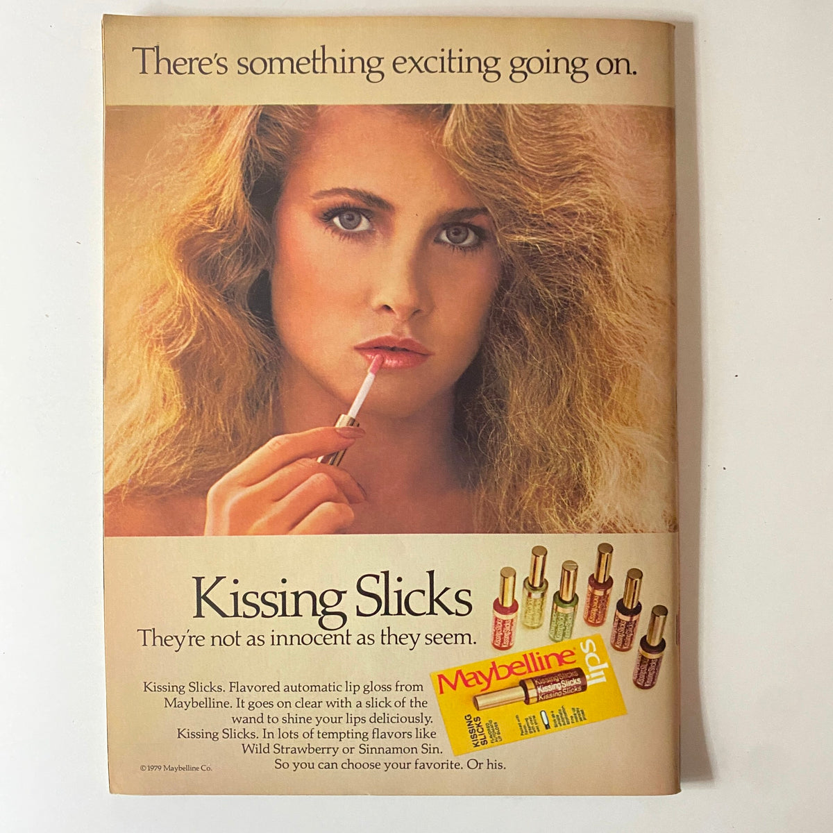 Teen Beat Magazine May 1981 featuring a Maybelline advertisement for Kissing Slicks lip gloss with a model applying the product, showcasing the appeal of 80s beauty trends.