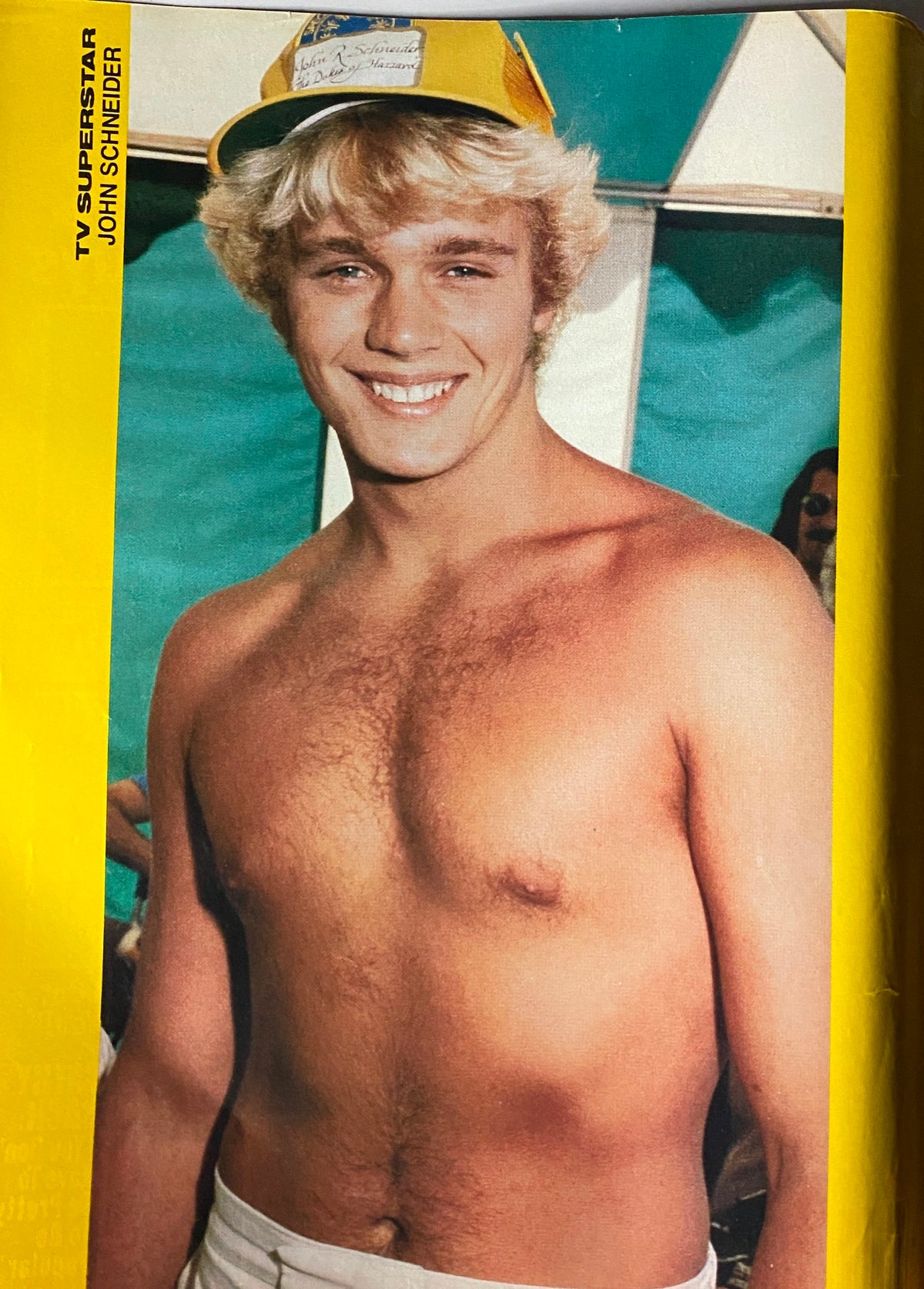 TV Superstar Magazine June 1980 showcasing a young John Schneider smiling, wearing a yellow cap, in a candid beach photo.