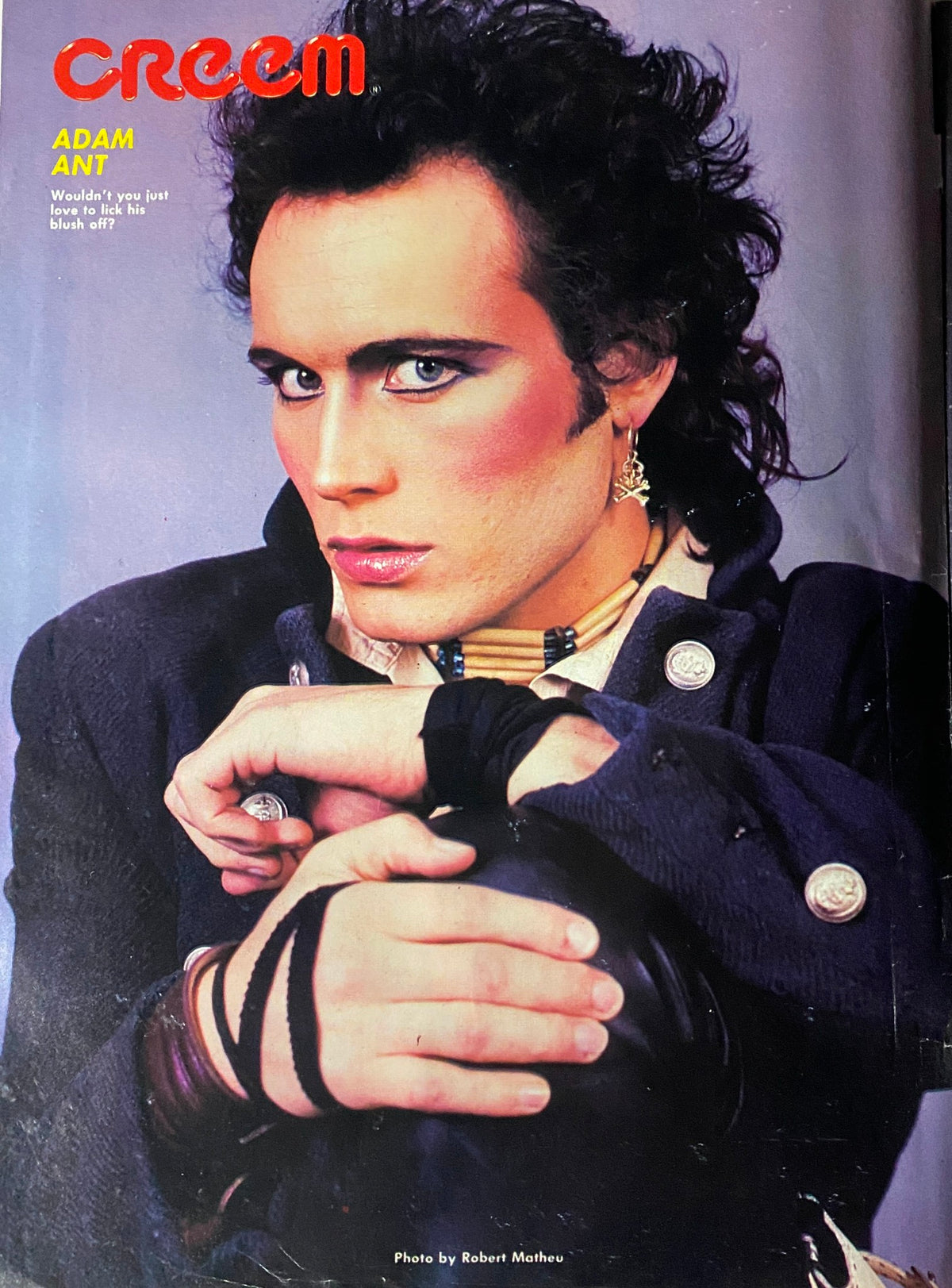 Portrait of Adam Ant from Creem Close-Up: Heavy 100, October 1983, showcasing his distinct makeup and fashion style.
