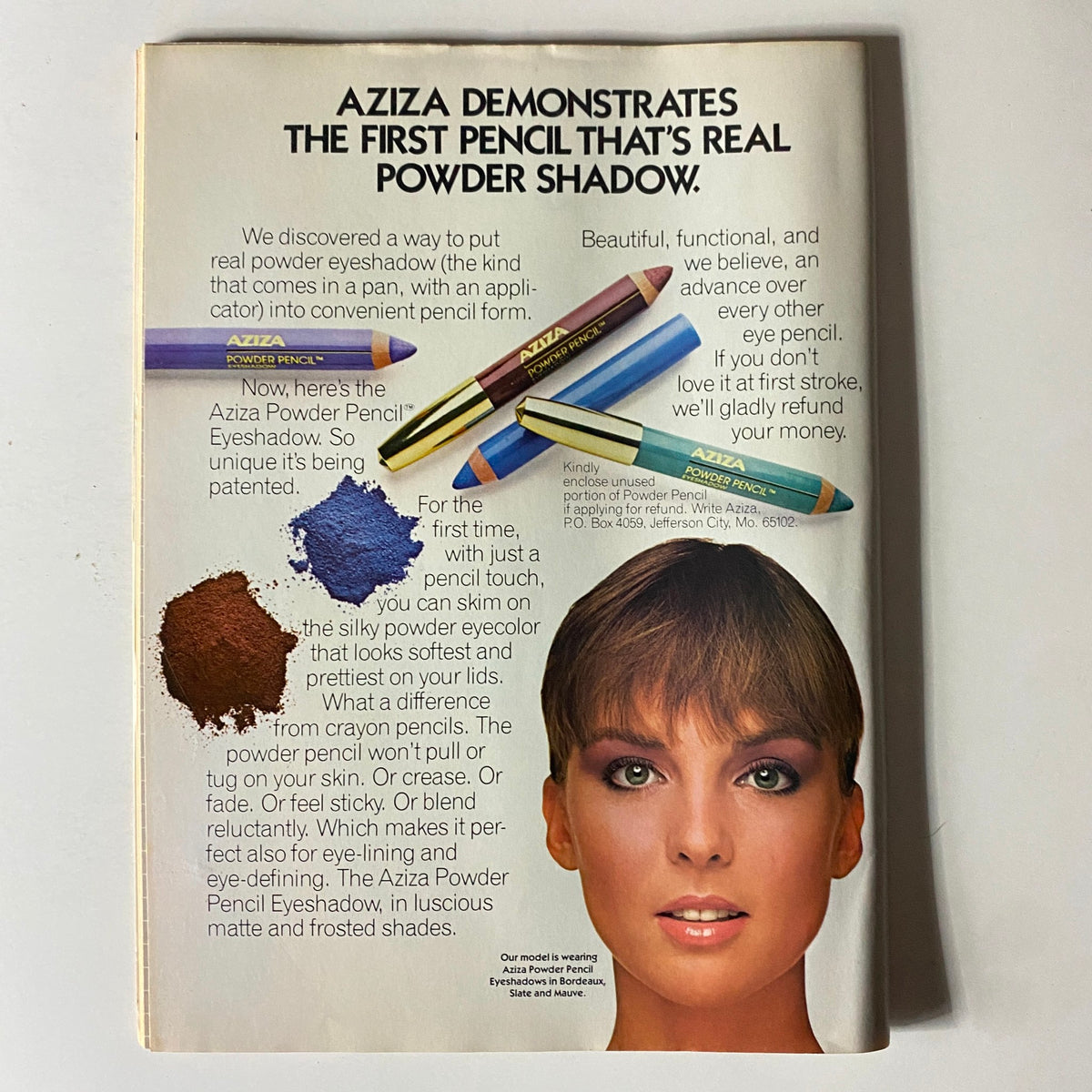 Advert for Aziza Powder Pencil Eyeshadow in Beauty Digest Magazine May 1984, showcasing innovative beauty products and applications.