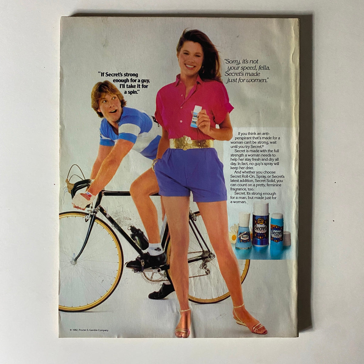 Seventeen Magazine June 1983 advertisement featuring a woman and a man on a bicycle, promoting Secret deodorant with a playful message.