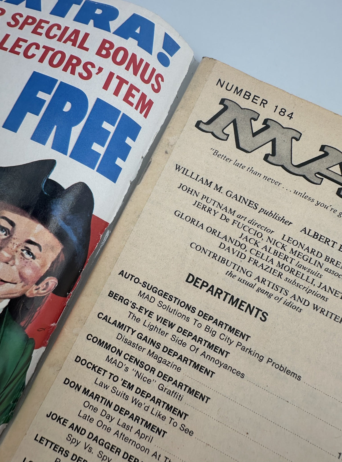 Detailed view of the inside of MAD Magazine No. 184 from July 1976, showcasing the departments and features such as 'Disaster Magazine' and 'Law Suits We'd Like to See.'