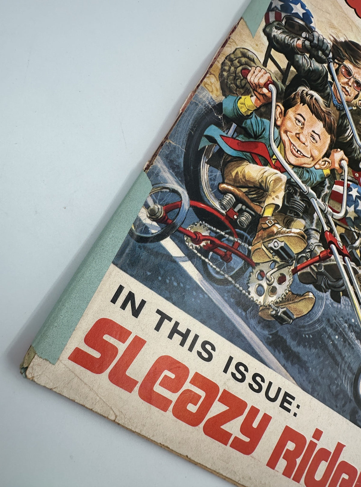 Close-up of the cover of MAD Magazine No. 135, June 1970, emphasizing the segment 'Sleazy Riders' with a detailed view of the worn edges and vintage style.