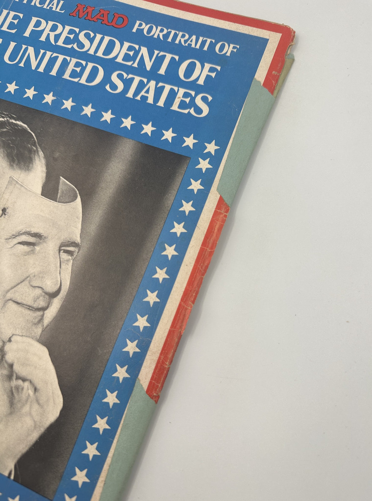 Close-up of MAD Magazine No. 135 June 1970 cover page featuring Richard Nixon with a comedic mask overlay, showcasing wear and tear on the magazine.