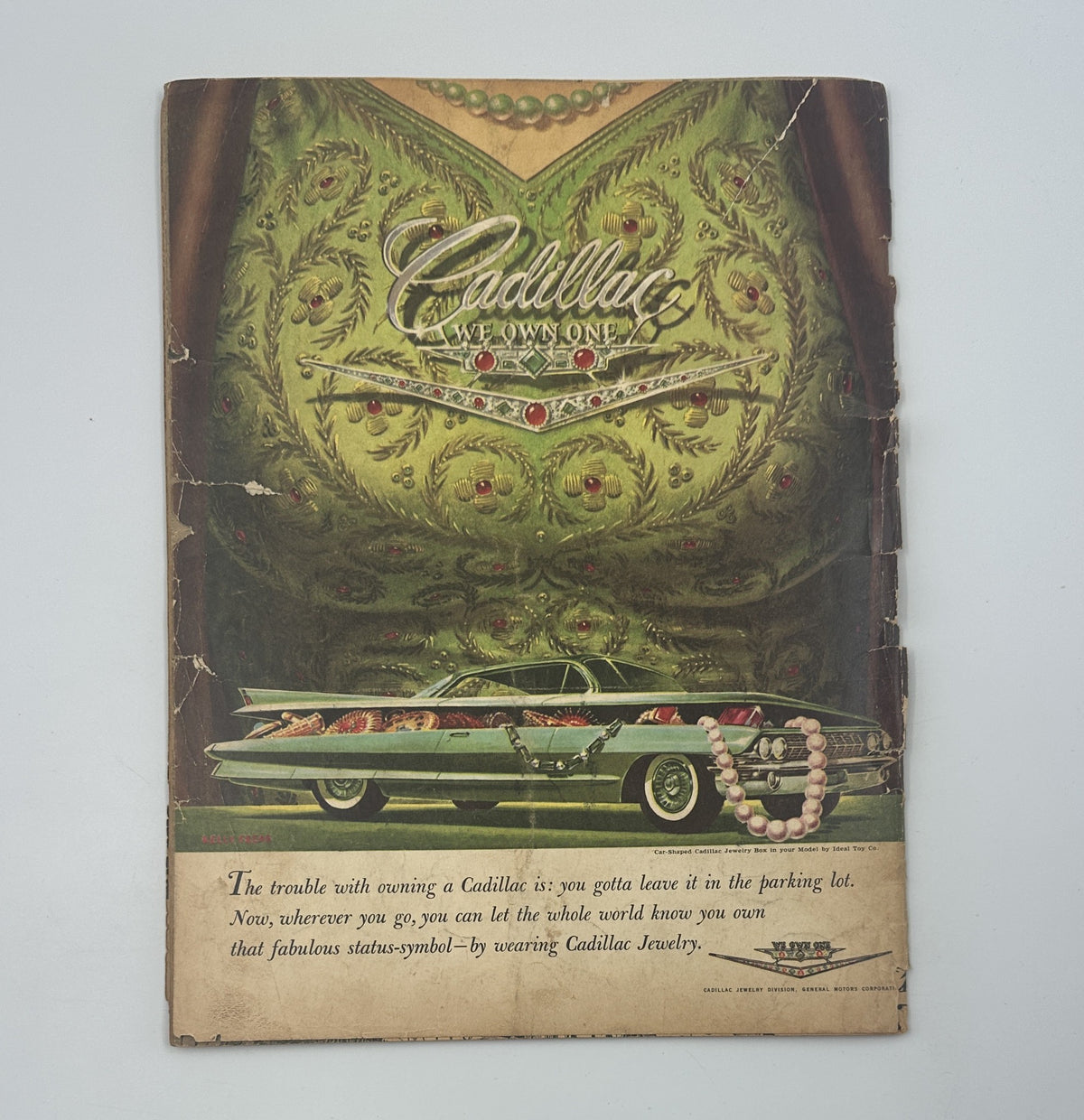 Back cover of MAD Magazine No. 65 September 1961 featuring an advertisement for Cadillac, showcasing the car prominently in a decorative setting. This ad illustrates the lifestyle theme associated with the magazine's content.