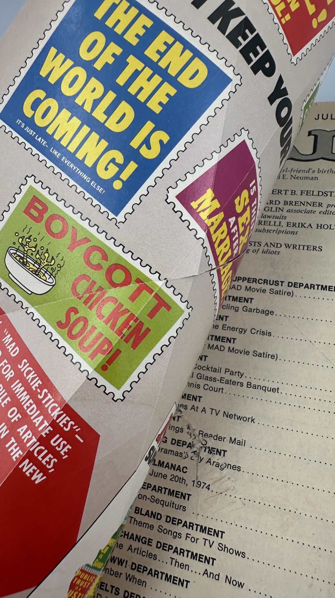 Inside page of MAD Magazine No. 168 from July 1974 featuring bold colors and texts including 'The End of the World is Coming!' and advertisements for MAD merchandise, reflecting the humor of the era.