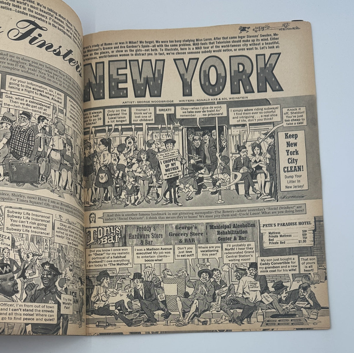 Inside spread of MAD Magazine No. 100 from January 1966, showcasing an illustration featuring various characters in New York, along with thematic advertisements and comic elements.