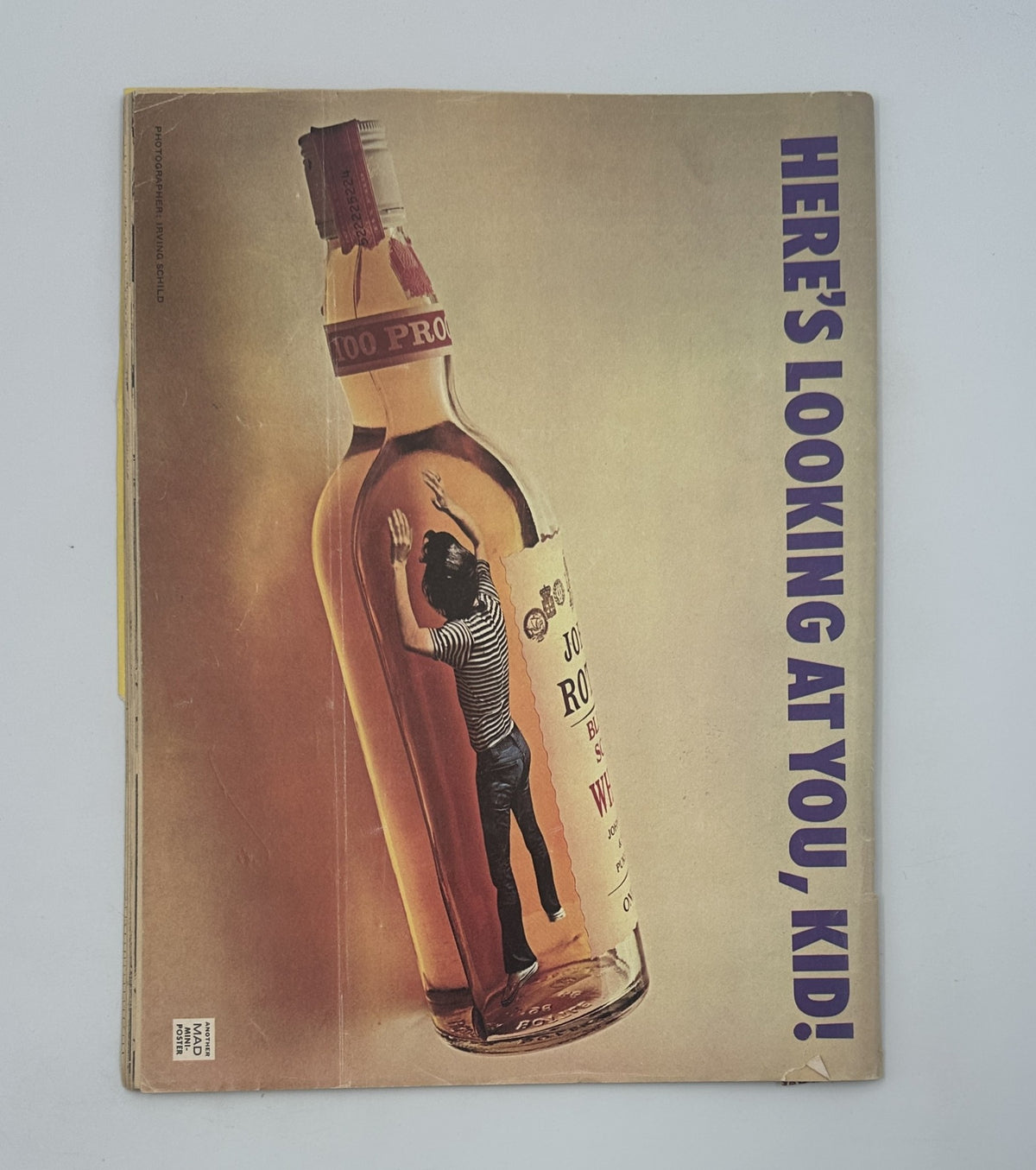 Back cover of MAD Magazine No. 178 October 1975, featuring a striking illustration of a bottle with the phrase 'HERE'S LOOKING AT YOU, KID!' in a captivating design.
