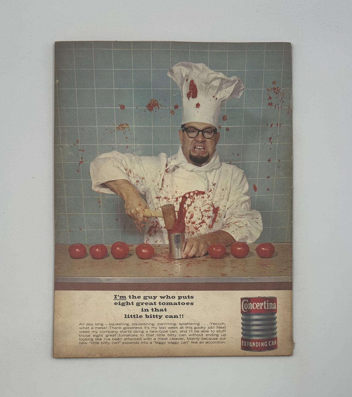 Back cover of MAD Magazine No. 84 January 1964 showcasing a humorous advertisement featuring a man dressed as a chef, blood splatters suggestive of a comedic mishap. This image adds to the quirky appeal of the vintage magazine.