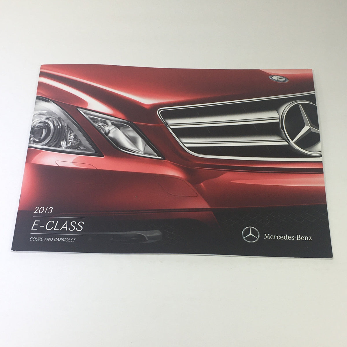 2013 Mercedes-Benz E-Class Coupe Cabriolet Dealership Car Auto Brochure Catalog cover featuring a close-up of the front grille and headlights.