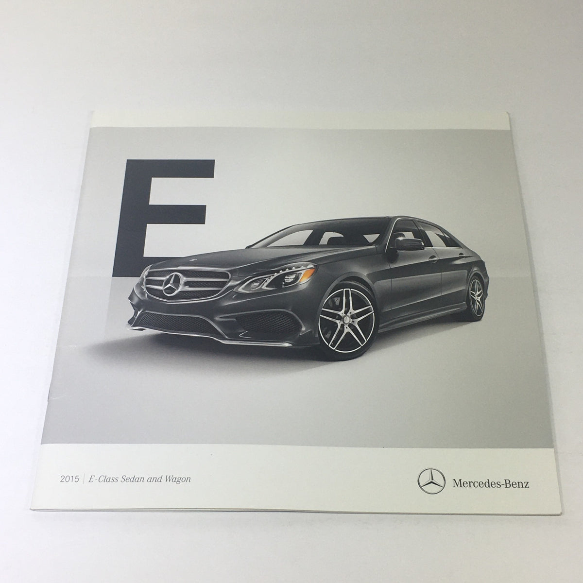 2015 Mercedes-Benz E-Class Sedans & Wagon Dealership Car Auto Brochure Catalog cover featuring a sleek Mercedes-Benz sedan.