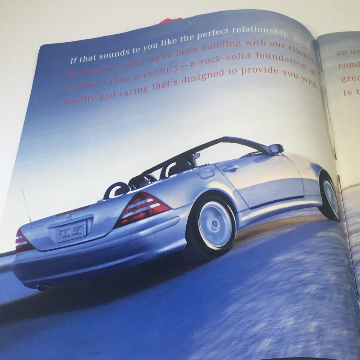 2001 Mercedes-Benz SLK-Class Dealership Car Auto Brochure Catalog image featuring a silver convertible car on a scenic road.
