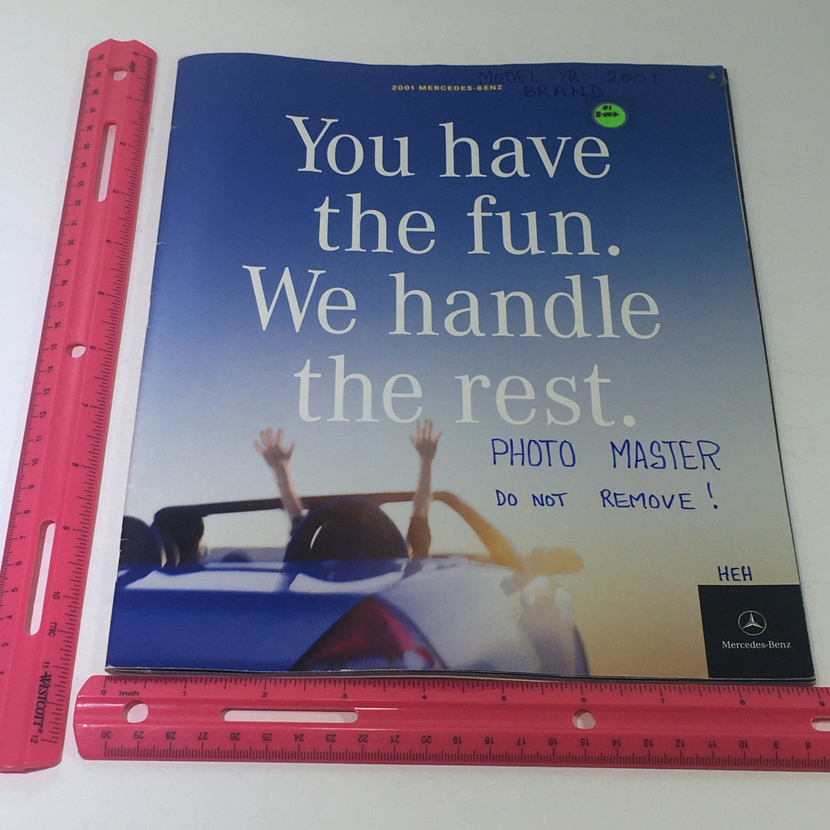 Front cover of the 2001 Mercedes-Benz SLK-Class Dealership Car Auto Brochure Catalog, showcasing a vibrant image with the text 'You have the fun. We handle the rest.' and a model label.