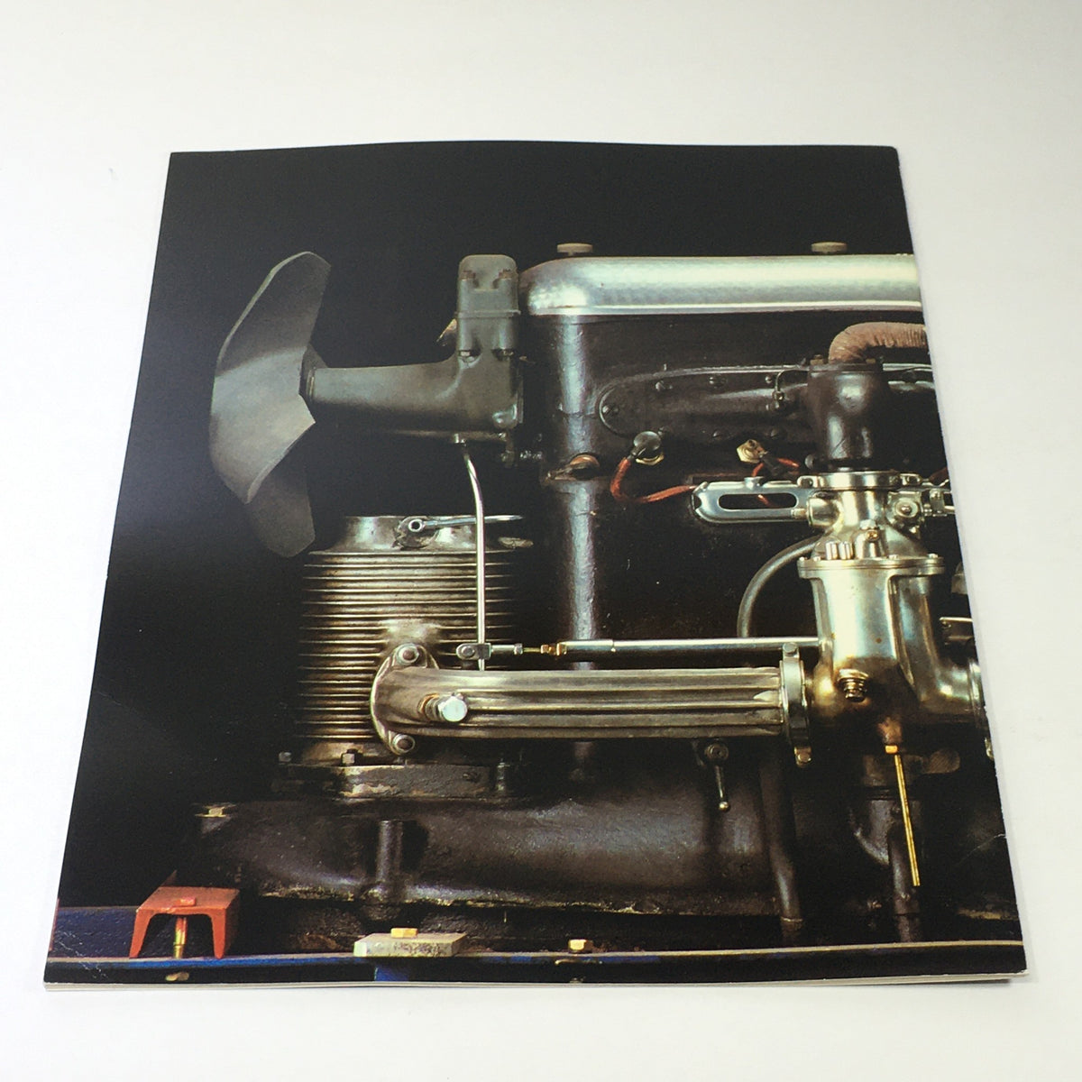 Detail of a vintage engine featured in the 1982 Mercedes-Benz Volume V Dealership Car Auto Brochure Catalog, showcasing precision engineering and craftsmanship.