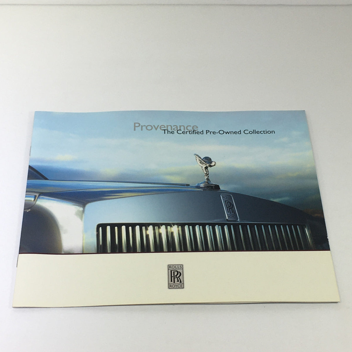 2013 Rolls Royce Provenance Collection Dealership Car Auto Brochure Catalog featuring the iconic Rolls Royce grille and Spirit of Ecstasy emblem, showcasing luxury automotive design.