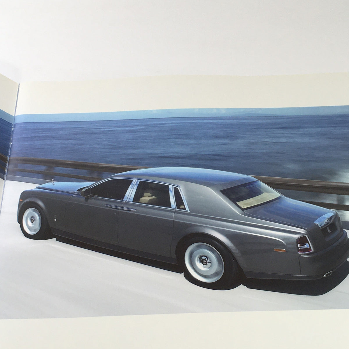 Side view of a 2013 Rolls Royce Provenance Collection Dealership Car showcasing its sleek design and luxurious features.