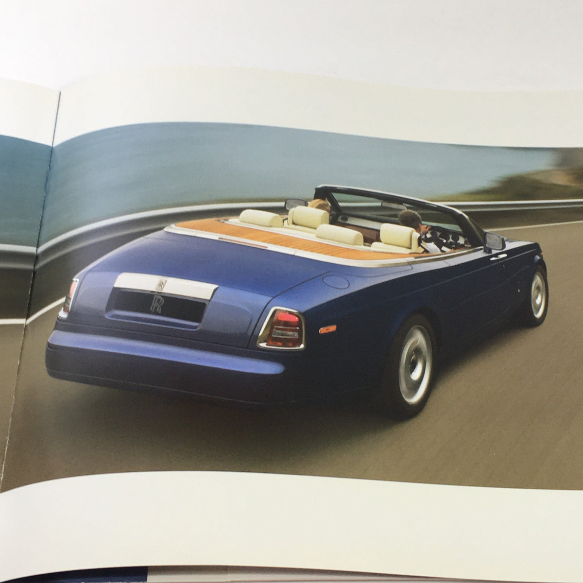Rear view of a 2013 Rolls Royce Provenance Collection convertible, highlighting its elegant lines and premium interior.
