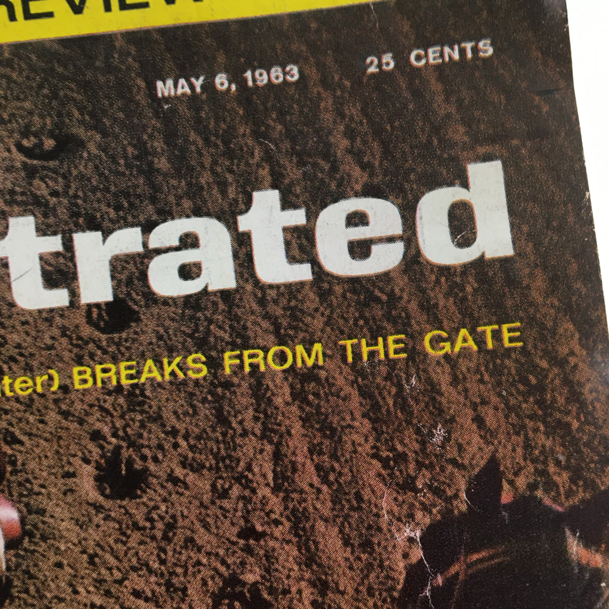 Close-up view of the Vintage Sports Illustrated Magazine title and date from the May 6, 1963 issue featuring 'Candy Spots Breaks From The Gate'.