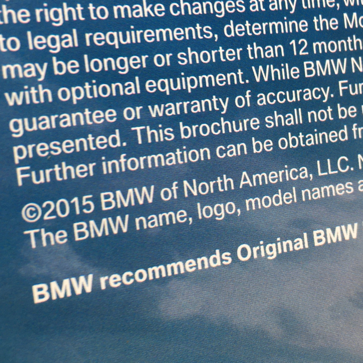 Copyright information from the 2015 BMW eDrive Technology 330e X5 Sedan Dealership Car Auto Brochure Catalog, emphasizing BMW's commitment to accuracy and innovation.