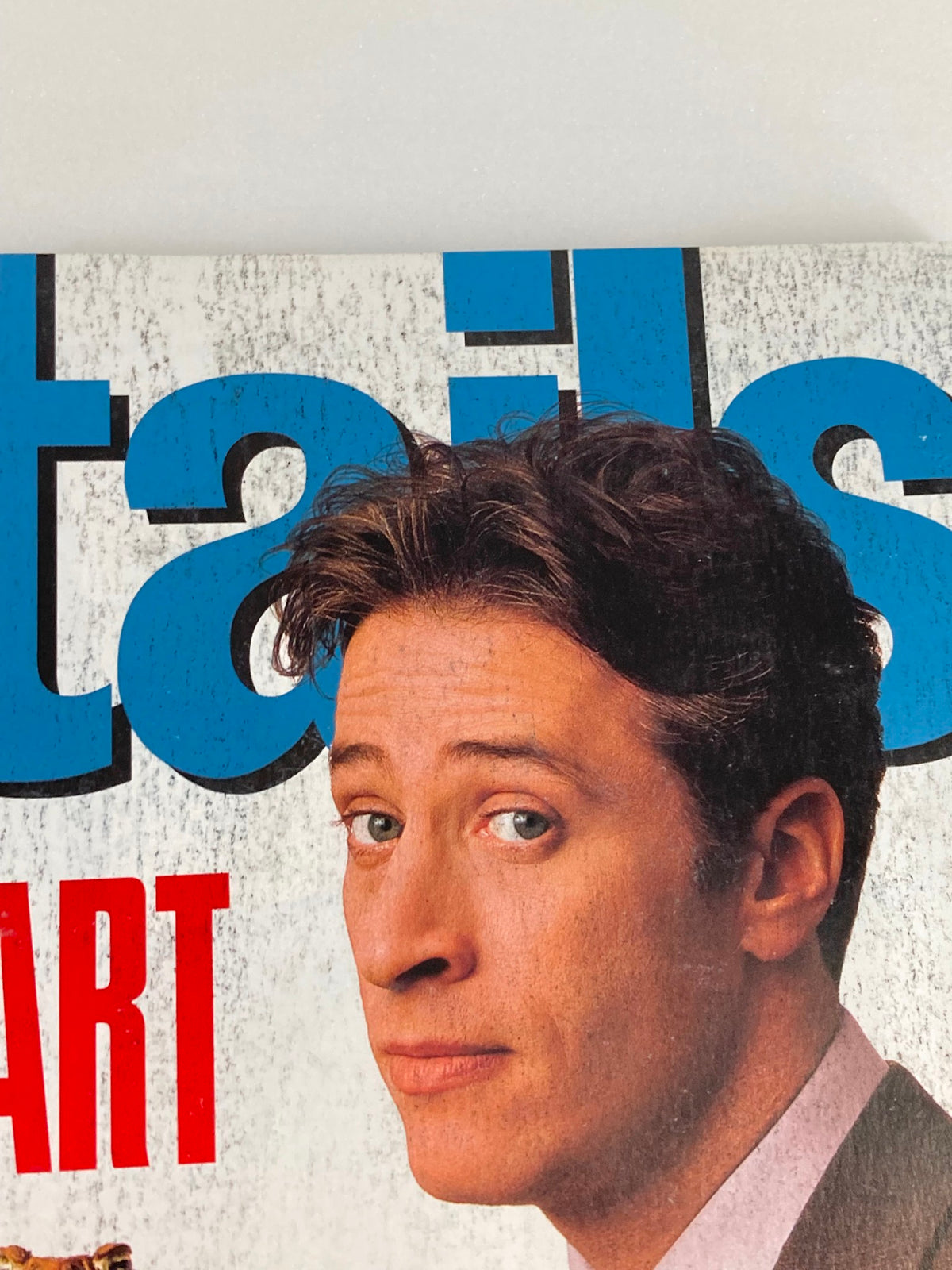 Close-up of Jon Stewart on the cover of Details Magazine, June 1999, with the title prominently displayed.