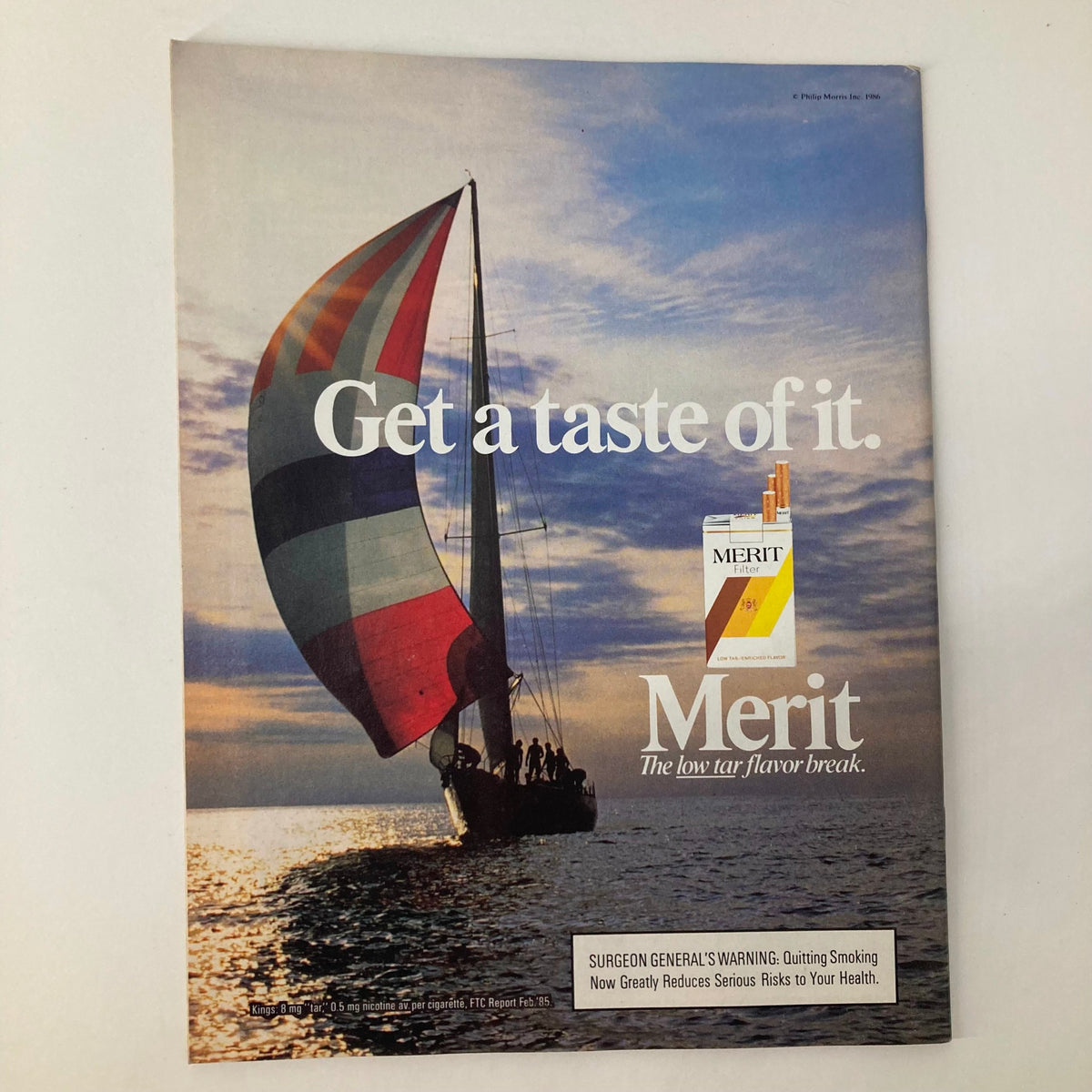 Vintage advertisement featuring a colorful sailboat with the tagline 'Get a taste of it.' The ad promotes Merit cigarettes, highlighting the low tar flavor and includes a health warning. This image is featured in the VTG Newsweek Magazine from March 17, 1986, titled 'An Epidemic Strikes Middle America.'