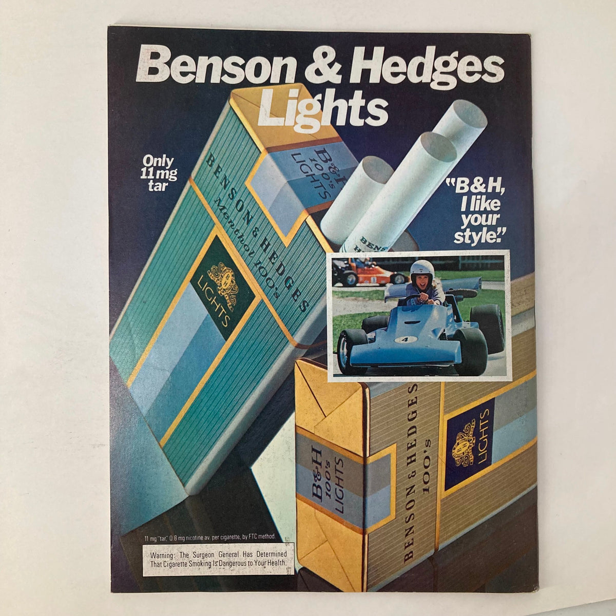 Cover of Benson & Hedges Lights advertisement showcasing cigarette pack design with the tagline 'B&H, I like your style.' featuring a young boy in a blue go-kart on the side.