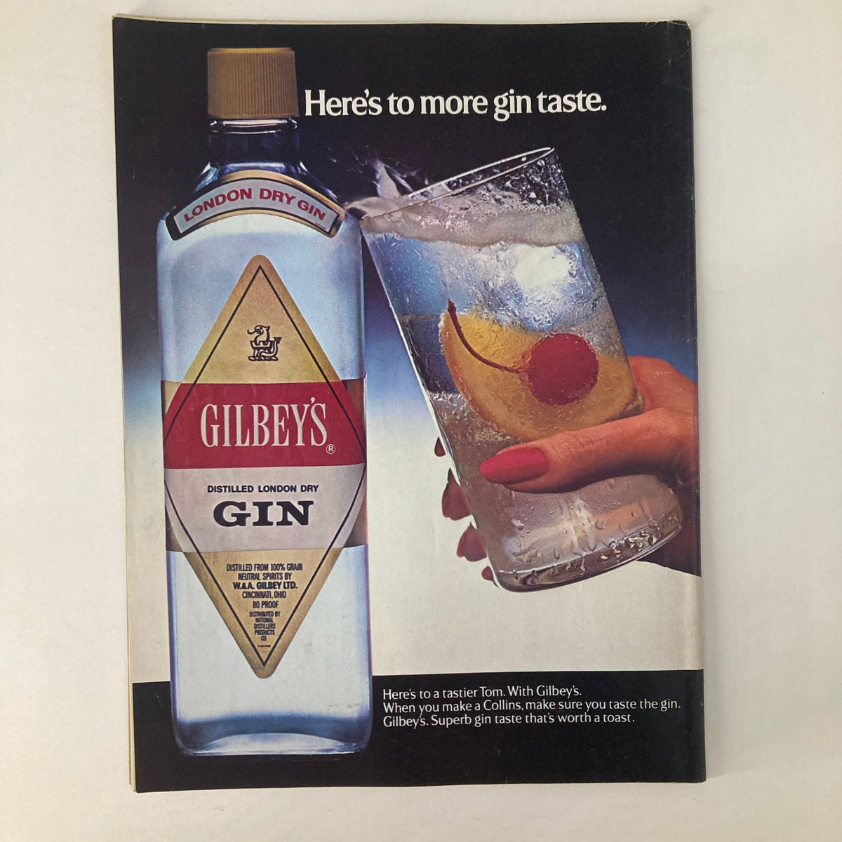 Advertising page from the VTG Newsweek Magazine August 13 1984 featuring a Gilbey’s Gin advertisement with a glass of gin and garnishes.