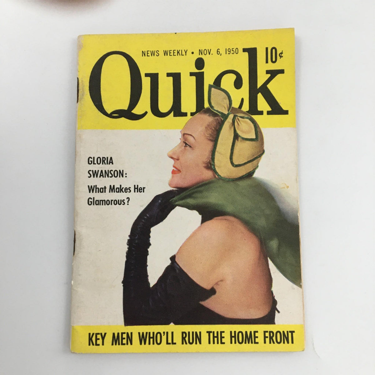 Cover of Quick Magazine dated November 6, 1950 featuring Gloria Swanson, showcasing her glamorous look with a stylish hat and scarf, emphasizing the allure of mid-20th century cinema.