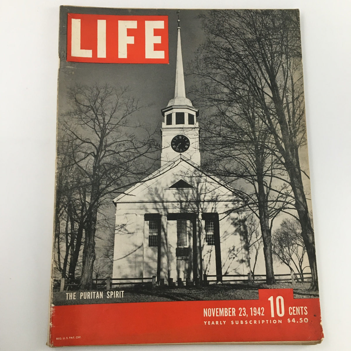 Cover of the VTG Life Magazine, November 23, 1942 edition, featuring 'The Puritan Spirit'. The magazine includes a depiction of a church with a clock and trees in the background, highlighting wartime coverage and cultural reflections from the era.