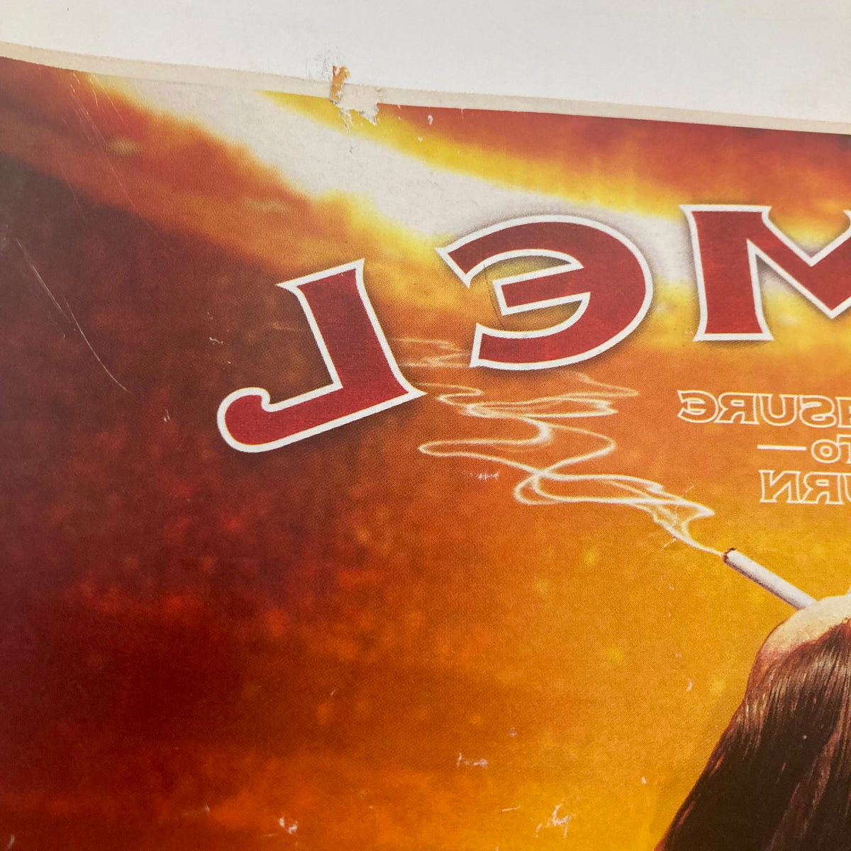 Close-up of Rolling Stone Magazine October 20 2005 cover detail showing a cigarette and part of the magazine's design, emphasizing vintage aesthetics and collector appeal.