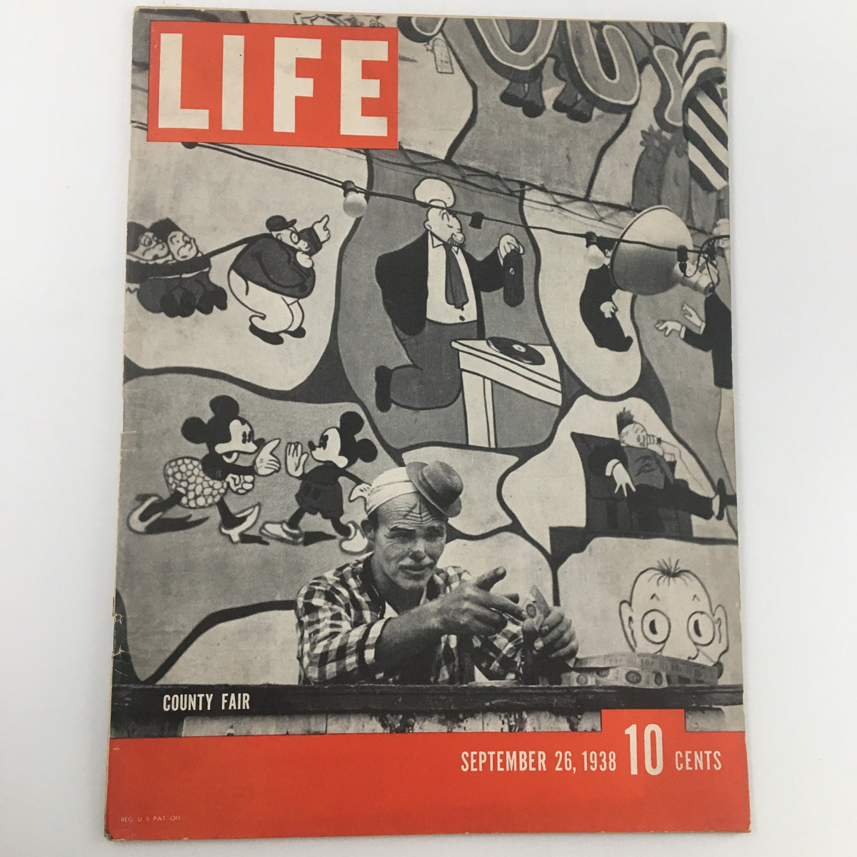 VTG Life Magazine September 26 1938 cover featuring a county fair scene with a man at a concession stand and illustrated background characters including Mickey Mouse, representing a nostalgic piece of Americana.